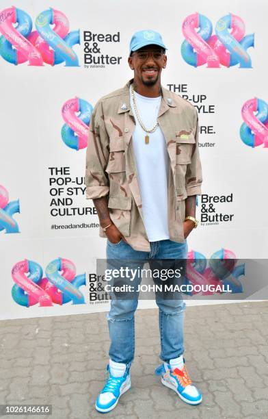 Bayern Munich's German defender Jerome Boateng poses for photographers as he visits the Bread and Butter B&B fashion fair on September 2, 2018 in...