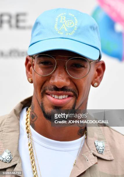 Bayern Munich's German defender Jerome Boateng poses for photographers as he visits the Bread and Butter B&B fashion fair on September 2, 2018 in...