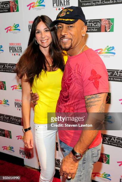 Television talk host Montel Williams and guest arrive for the 4th annual "Ante Up for Africa Celebrity-Charity Poker Tournament" at The Rio Hotel And...