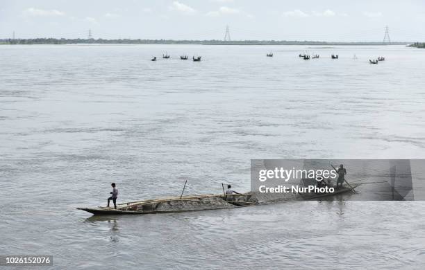 Sand diggers extract sand from Beki River in Sarbhog, under Barpeta district in Assam, India on Sunday September 2, 2018.