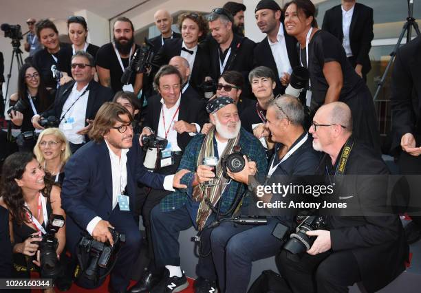 Bruce Weber with the red carpet photographers ahead of the 'My Brilliant Friend ' screening during the 75th Venice Film Festival at Sala Grande on...