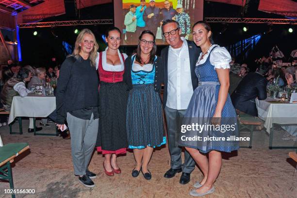 Bavaria, Tutzing: The actor and host Michael Roll, his wife Claudia and his daughters Sophia Roll , Katherina Roll and Johanna Roll smile at the...