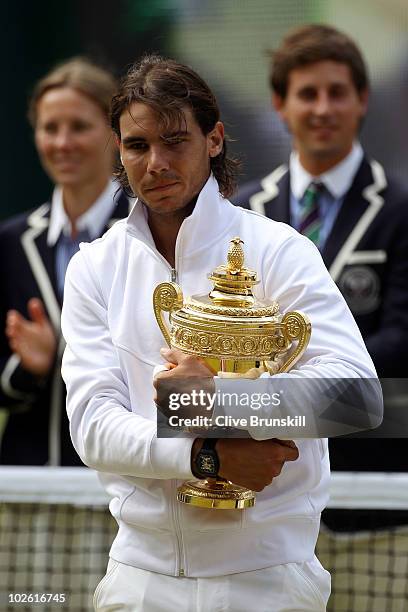 Rafael Nadal of Spain holds the Championship trophy after winning the Men's Singles Final match against Tomas Berdych of Czech Republic on Day...