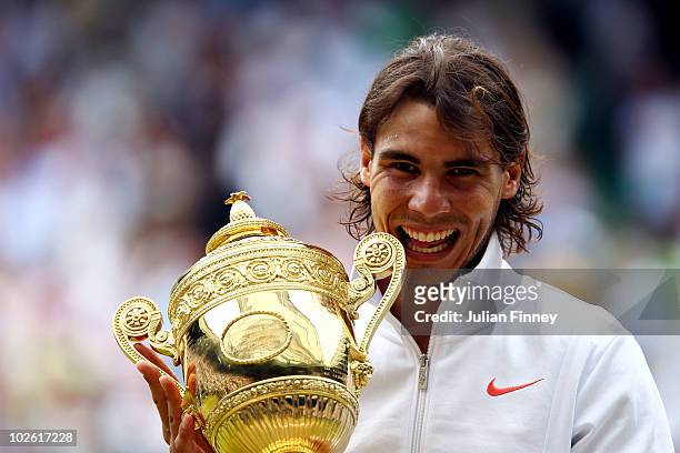 Rafael Nadal of Spain holds the Championship trophy after winning the Men's Singles Final match against Tomas Berdych of Czech Republic on Day...