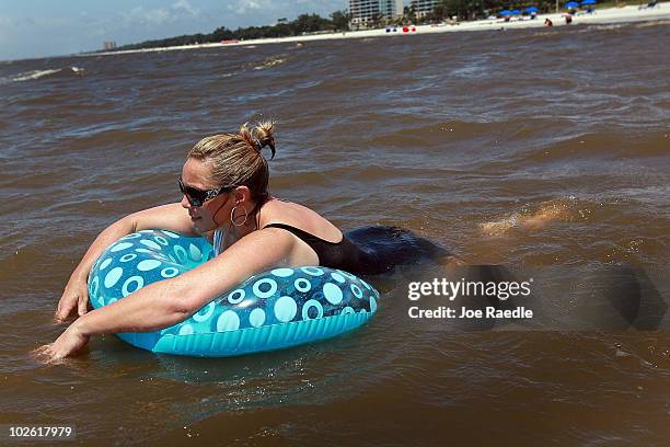 Jackie Norwood on vacation from Oklahoma enjoys the beach despite the threat of contamination from the Deepwater Horizon oil spill in the Gulf of...