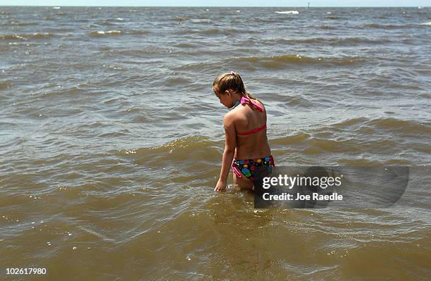 Emma Holmes on vacation from Texas enjoys the beach despite the threat of contamination from the Deepwater Horizon oil spill in the Gulf of Mexico on...