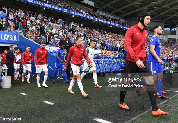 Petr Cech of Arsenal leads the team out before the Premier League match between Cardiff City and Arsenal FC at Cardiff City Stadium on September 2,...