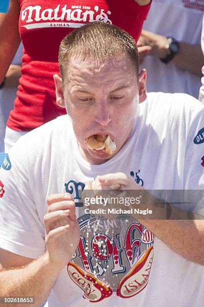 Joey Chestnut competes in the 2010 Nathan's Famous Fourth of July International Hot Dog Eating Contest at the original Nathan's Famous in Coney...