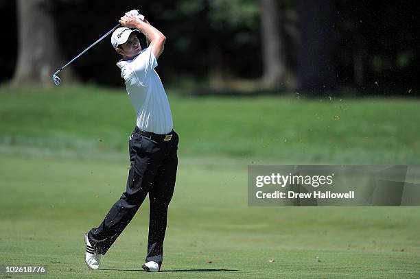 Justin Rose of England watches his second shot on the first hole during the final round of the AT&T National at Aronimink Golf Club on July 4, 2010...