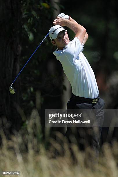 Justin Rose of England watches his tee shot on the second hole during the final round of the AT&T National at Aronimink Golf Club on July 4, 2010 in...