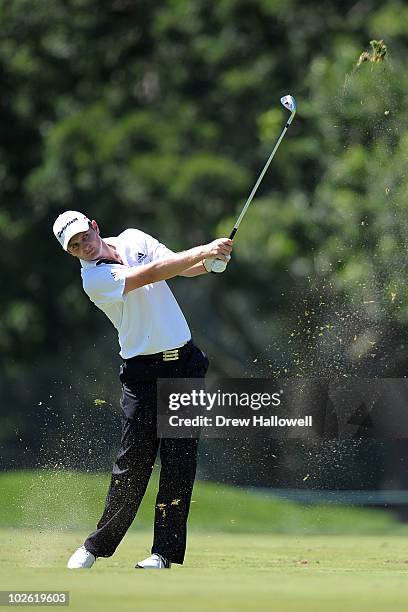 Justin Rose of England watches his second shot on the third hole during the final round of the AT&T National at Aronimink Golf Club on July 4, 2010...