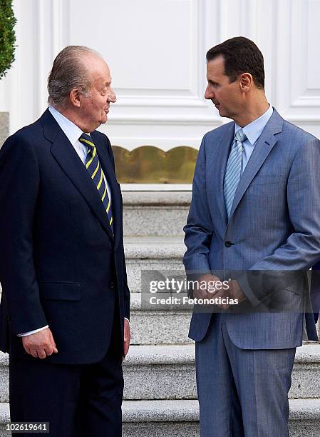 King Juan Carlos of Spain and Syrian Arab Republic President Bashar al-Assad pose for photographers at Zarzuela Palace on July 4, 2010 in Madrid,...