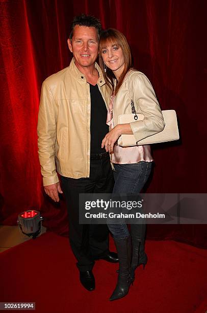 Tom Burlinson and wife Mandy Carnie arrive for the opening night of West Side Story at Star City on July 4, 2010 in Sydney, Australia.