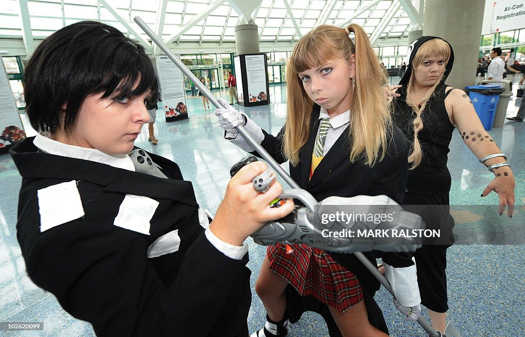 Anime fans pose for photos as they arriv