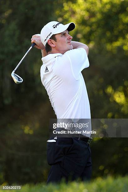 Justin Rose of England watches his tee shot on the 17th hole during the final round of the AT&T National at Aronimink Golf Club on July 4, 2010 in...