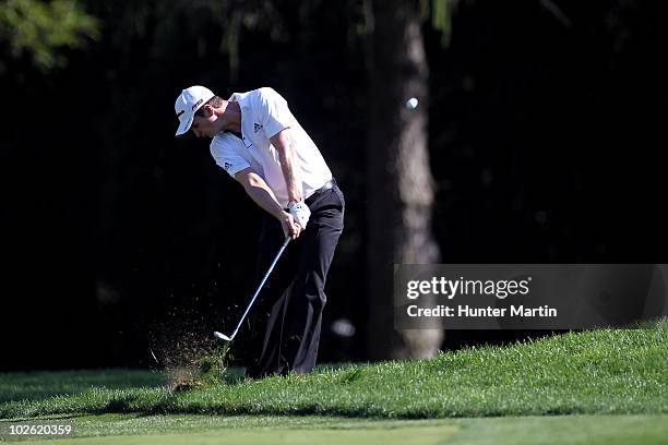 Justin Rose of England hits his second shot on the 13th hole during the final round of the AT&T National at Aronimink Golf Club on July 4, 2010 in...