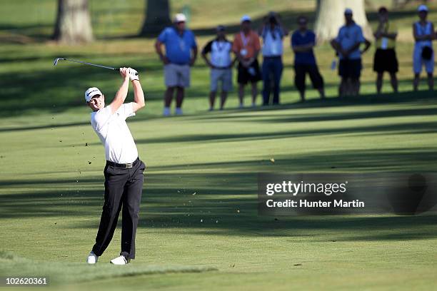 Justin Rose of England hits his second shot on the 16th hole during the final round of the AT&T National at Aronimink Golf Club on July 4, 2010 in...