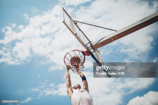 basketball shooting - basketball dunk stock pictures, royalty-free photos & images