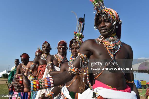 Samburu warriors known as Moran pose for a photo during a three-day 29th edition of the Maralal International Camel Derby at Maralal, Samburu County,...