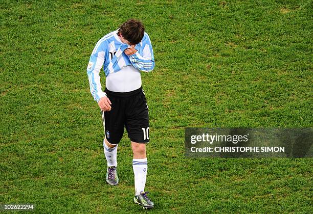 Argentina's striker Lionel Messi walks off the pitch after the quarter final 2010 World Cup match Argentina versus Germany on July 3, 2010 at Green...