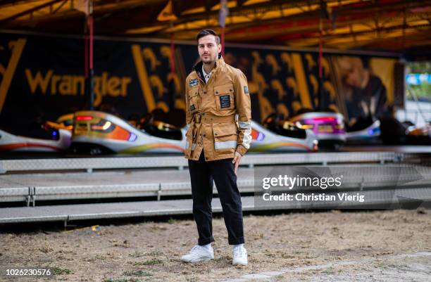 Roberto De Rosa wearing beige brown Belstaff jacket, black pants, white Fila sneakers is seen at the Bread&&Butter by Zalando at Arena Berlin on...