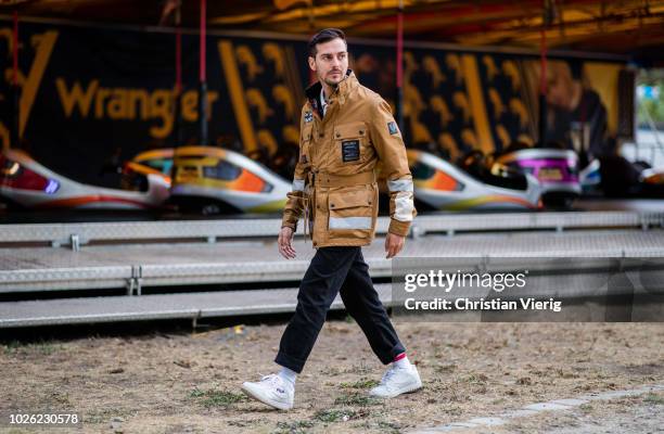 Roberto De Rosa wearing beige brown Belstaff jacket, black pants, white Fila sneakers is seen at the Bread&&Butter by Zalando at Arena Berlin on...