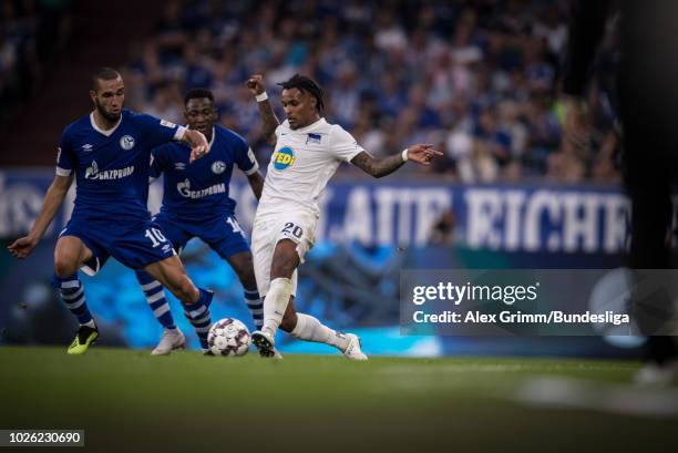 Valentino Lazaro of Berlin is challenged by Nabil Bentaleb of Schalke during the Bundesliga match between FC Schalke 04 and Hertha BSC at...