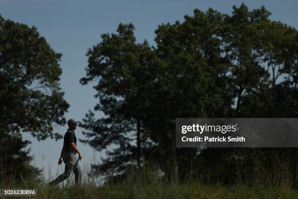 Rory McIlroy of Northern Ireland walks on the 12th hole during round three of the Dell Technologies Championship at TPC Boston on September 2, 2018...