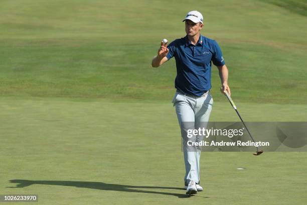 Justin Rose of England acknowledges the crowd on the ninth green during round three of the Dell Technologies Championship at TPC Boston on September...