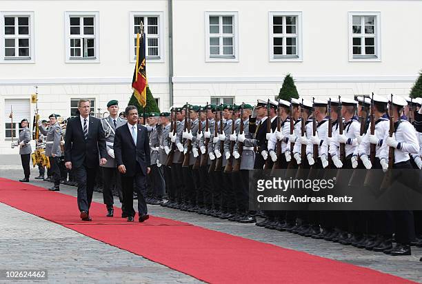 German President Christian Wulff and Leonel Fernandez Reyna, President of the Dominican Republic review a guard of honour upon Reyna's arrival at...