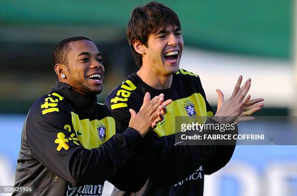 Brazil's midfielder Kaka laughs with teammate Robinho during a training session at the Randburg High School in Johannesburg on June 10, 2010 ahead of...