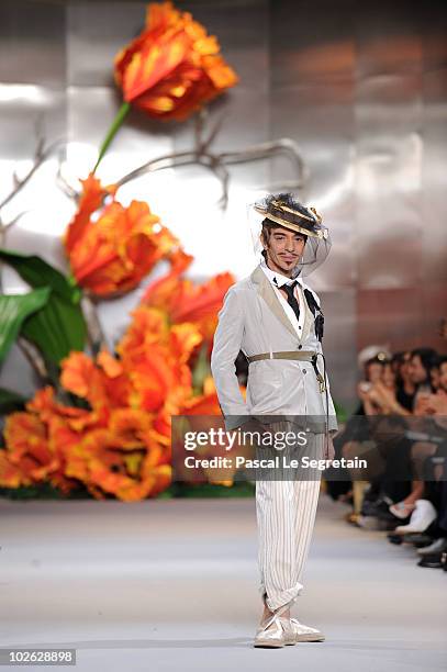 Designer John Galliano walks the runway at the end of the Dior show as part of the Paris Haute Couture Fashion Week Fall/Winter 2011 at Musee Rodin...