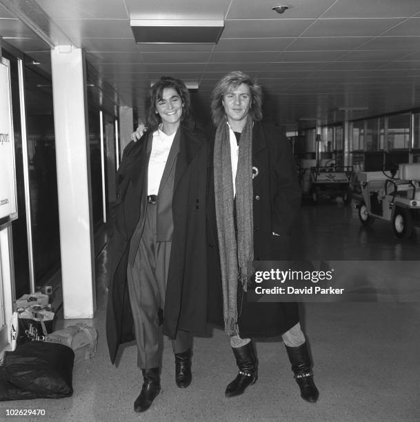 Duran Duran singer Simon Le Bon with partner Claire Stansfield at an airport on December 23, 1984.