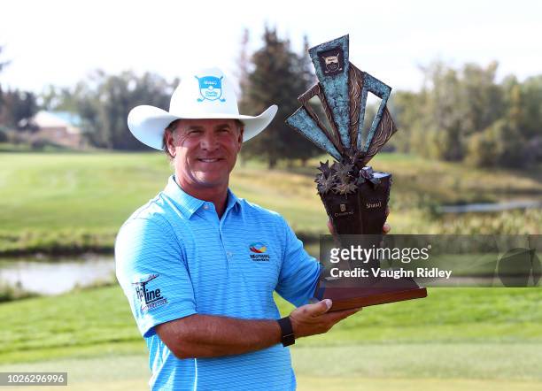 Scott McCarron of the United States with the champions trophy after winning the Shaw Charity Classic at the Canyon Meadows Golf and Country Club on...