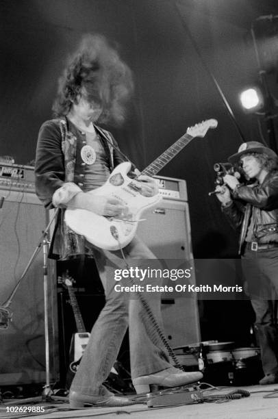 English singer Marc Bolan uses a wah-wah pedal during a T. Rex concert at the Empire Pool, Wembley, March 1972.