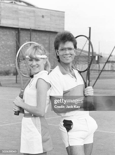 British tennis player Sue Barker poses with singer Cliff Richard on November 25, 1983.