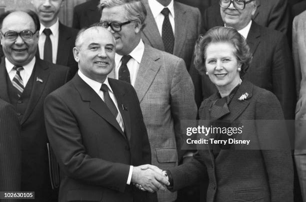 Soviet Politburo member Mikhail Gorbachev shakes hands with British Prime Minister Margaret Thatcher at Chequers on December 16, 1984.