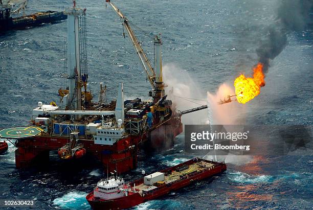 The Q4000 vessel burns off the oil and gas it collects at the site of the BP Plc Deepwater Horizon oil spill in the Gulf of Mexico off the coast of...
