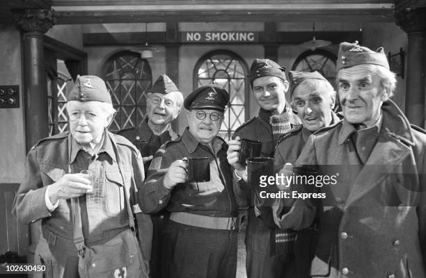 Left to right Arnold Ridley , Clive Dunn , Arthur Lowe , Ian Lavender , John Laurie and John Le Mesurier during an episode of the BBC comedy series...