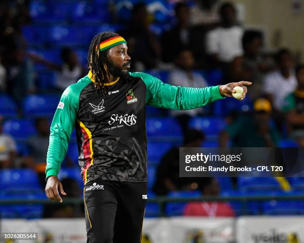 In this handout image provided by CPL T20, Chris Gayle of St Kitts & Nevis Patriots set the field during match 25 of the Hero Caribbean Premier...