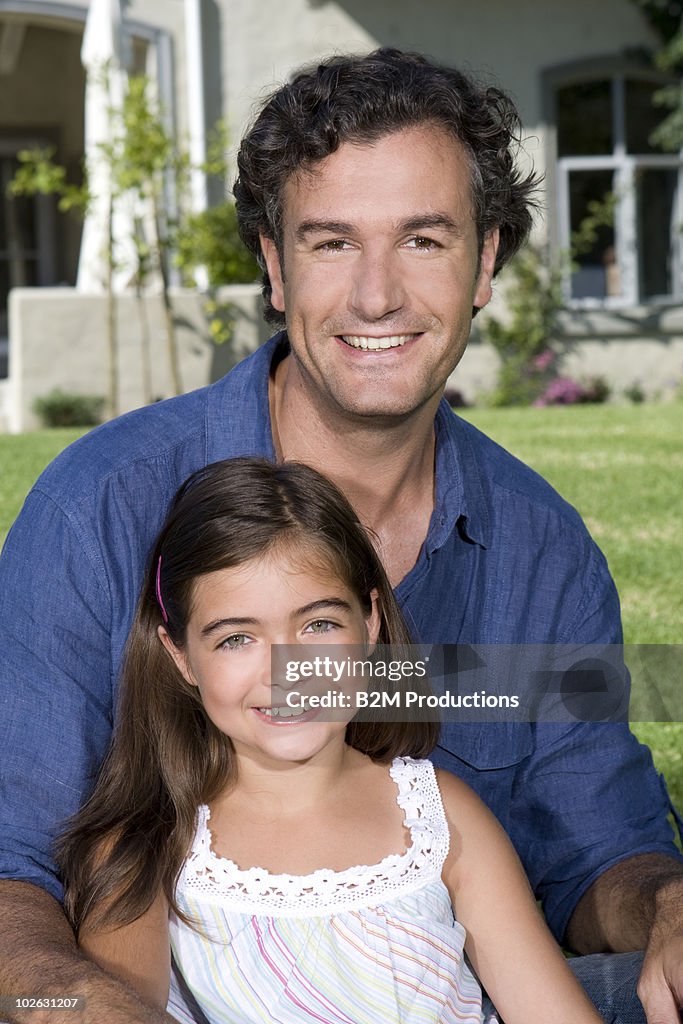 Father and daughter in garden