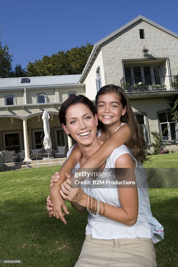 Mother and daughter in garden