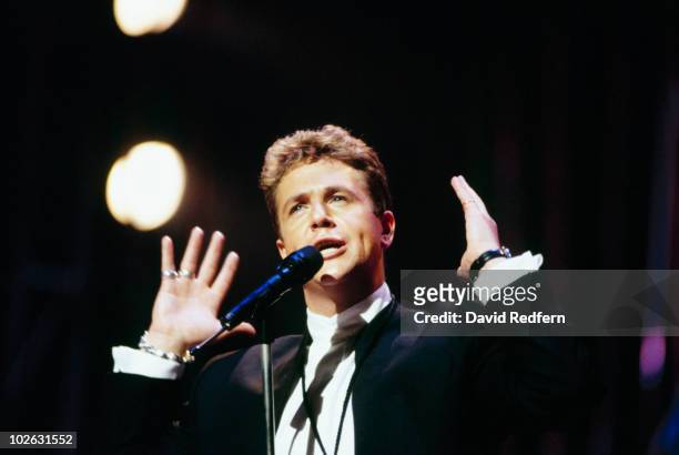 Singer Michael Ball performs on stage circa 1995.