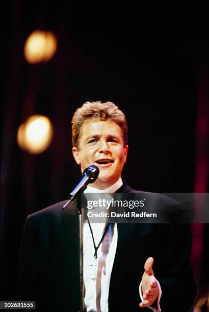 Singer Michael Ball performs on stage circa 1995.