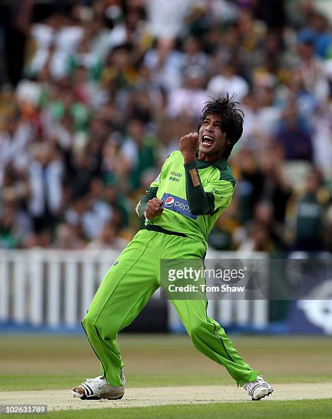 Mohammad Aamer of Pakistan celebrates taking the wicket of Shane Watson of Australia during the International Twenty20 match between Pakistan and...