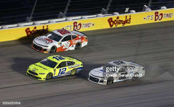 Ryan Blaney, driver of the Menards/Duracell Ford, leads a pack of cars during the Monster Energy NASCAR Cup Series Bojangles' Southern 500 at...