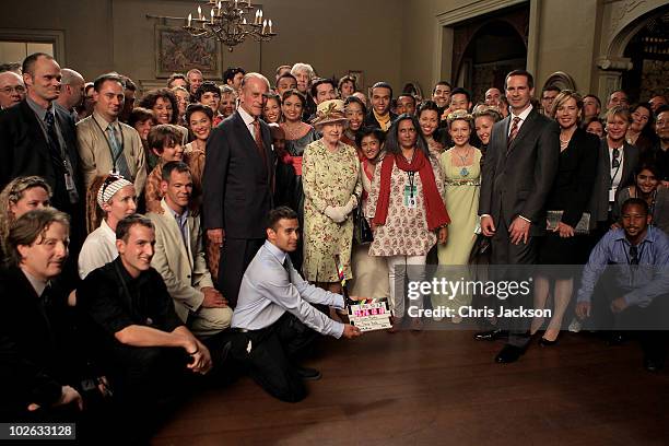 Queen Elizabeth II and Prince Philip, Duke of Edinburgh meet performers who worked in a 3D demonstation they saw during a visit to Pinewood Studios...