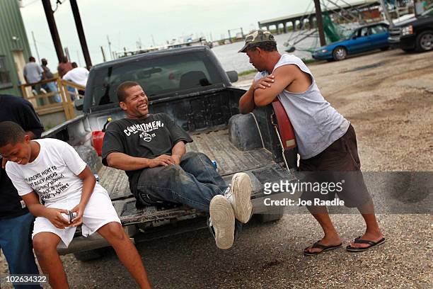 David Turner a former boat hand and Villere Demolle, an out of work fisherman, hang out at the Beshel Boat Launch on July 5, 2010 in East Pointe a La...