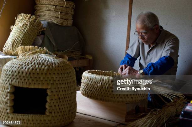 artisan crafting a japanese basket - traditional craftsman stock pictures, royalty-free photos & images