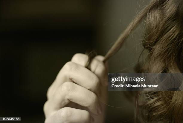 girl holding a slice of hair - pulling hair stock pictures, royalty-free photos & images